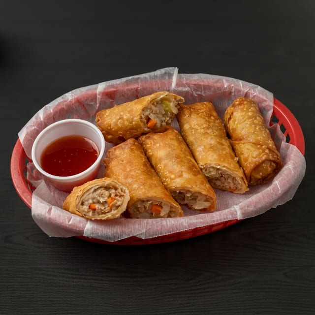 Flavorful Pork Egg Rolls with Sweet & Sour Sauce.